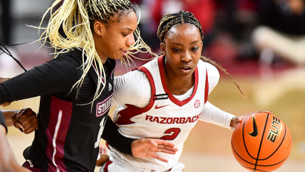 Razorbacks Samara Spencer drives against Mississippi State